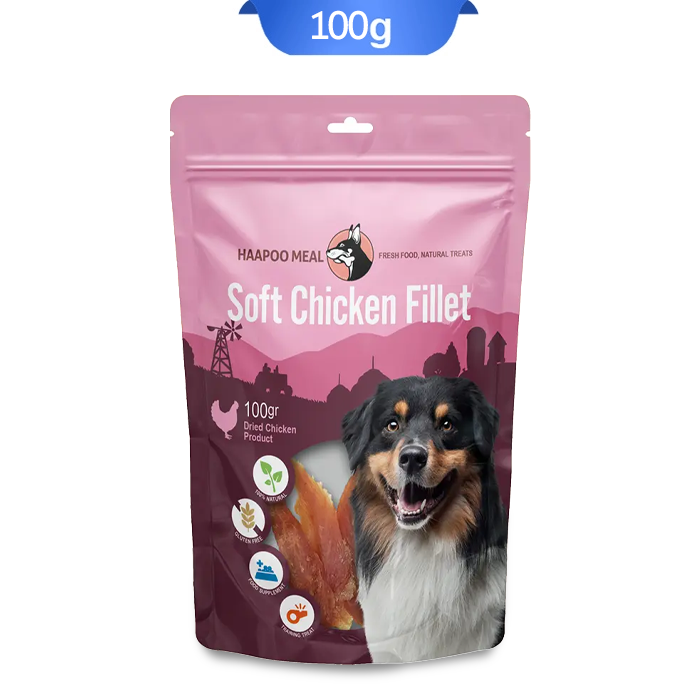 haapoomeal-soft-chicken-fillet تشویقی سگ هاپومیل مدل فیله نرم مرغ وزن 100 گرم که بسته بندی آن صورتی و تصویر سگ روی آن است.