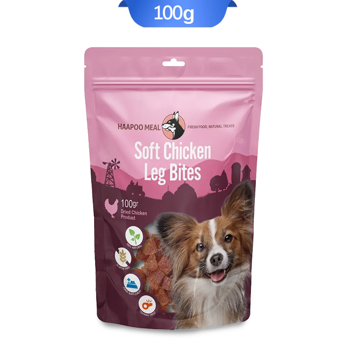 soft-chicken-leg-bites-100g تشویقی سگ هاپومیل مدل نخودی نرم ران مرغ وزن 100 گرم که بسته بندی آن صورتی و تصویر سگ روی آن است.